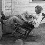 A Farmer Reading His Paper. Photographed by George W. Ackerman, Coryell County, Texas, September 1931.
